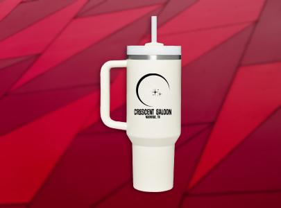 White Stanley Thumbler with large capacity, spillproof lid, and reusable straw, printed with Crescent Saloon in Nashville, TN logo